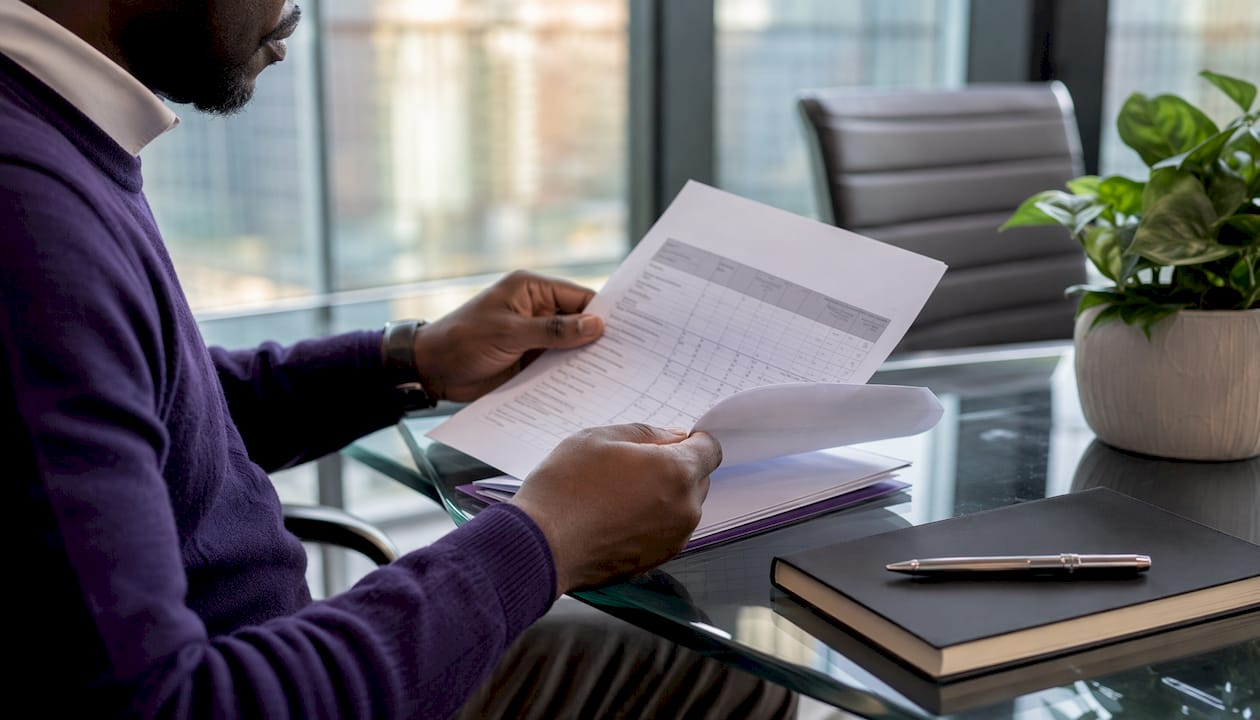 Hands reviewing ERP scoring rubric on table